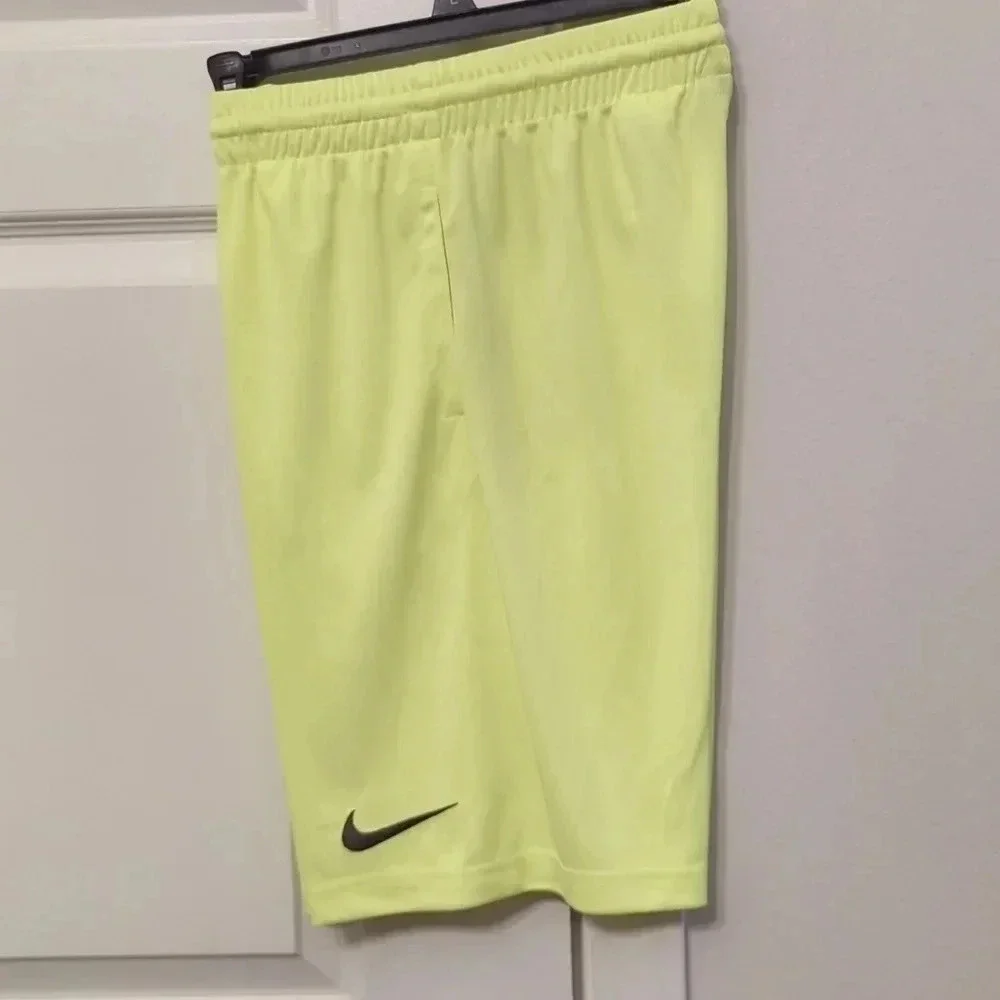 BOYS neon green Nike shorts